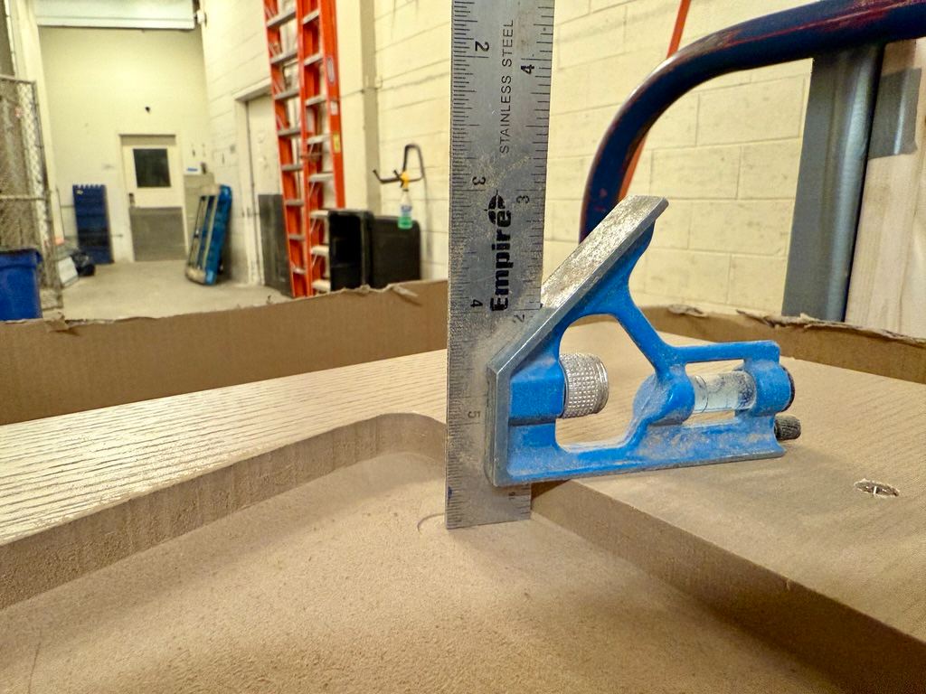 A curved edge checked with a combination square